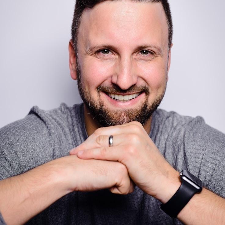 Avery Chen, Lead Design Curator at Atlas Garden Lane, reviewing corporate floral arrangements